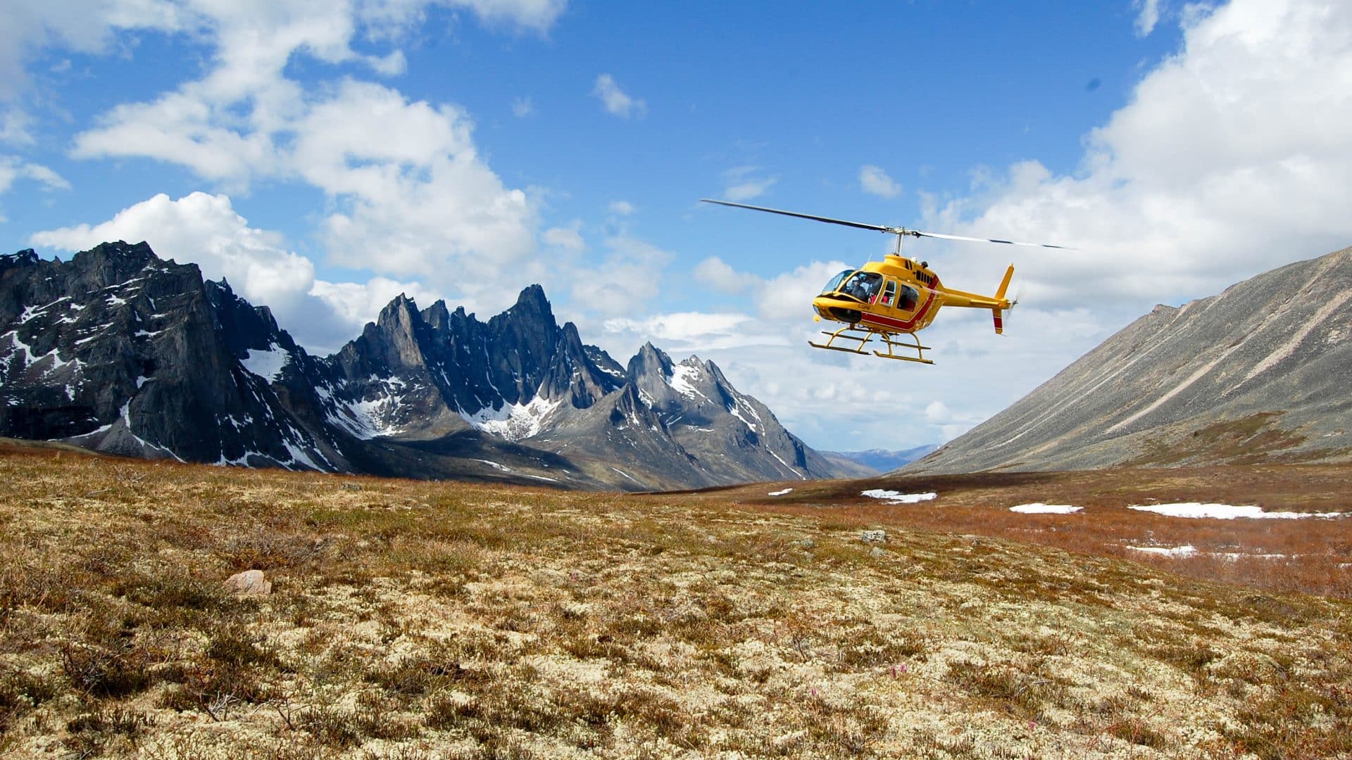 Explore Remote Valleys -Trekking Tombstone Mountain - transfer with helicopter